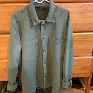 Faux leather. Medium green shirt jacket. Fits a little over sized.